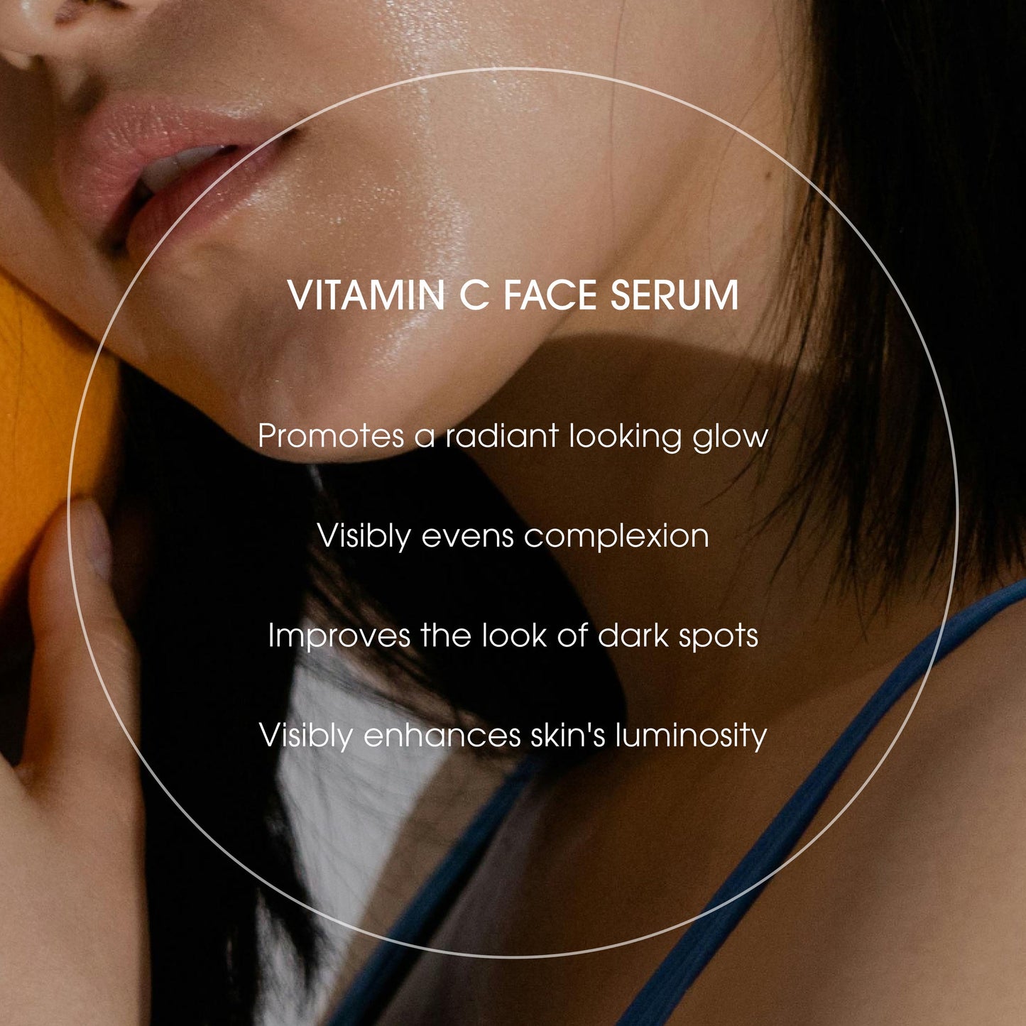 Advertisement for vitamin C face serum with text highlighting benefits on a blurred background
