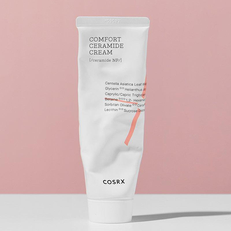 Cosrx Comfort Ceramide Cream tube on a pink background