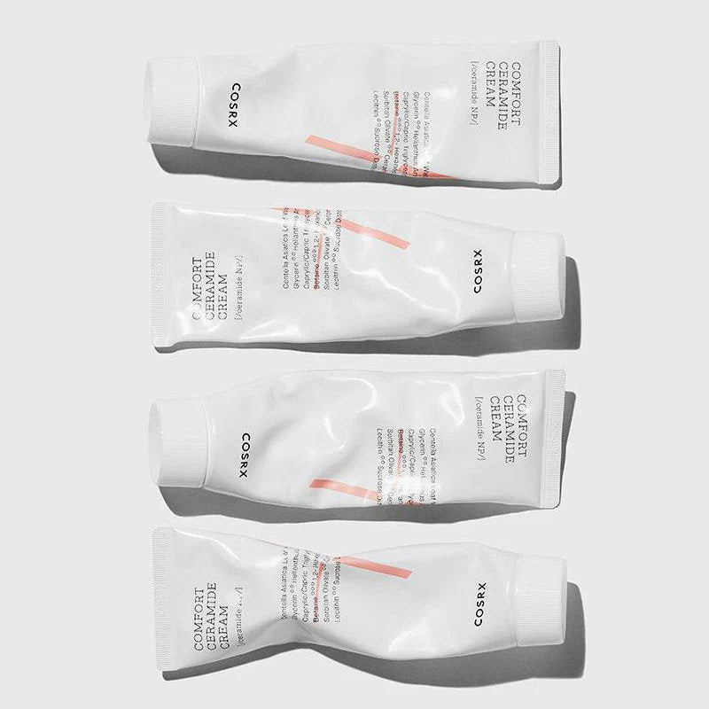 Four Cosrx skincare cream tubes on a white background