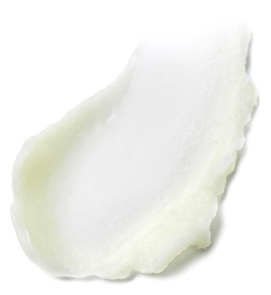 A close-up of a smear of Estée Lauder Advanced Night Cleansing Balm by ESTEE LAUDER, showcasing its creamy, slightly uneven texture with nourishing Safflower Seed Oil, spread on a white background.
