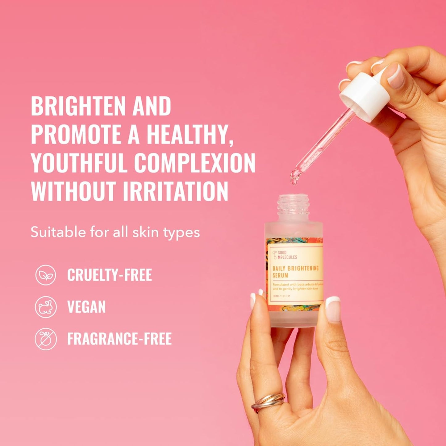 A hand holds an open Good Molecules Daily Brightening Serum 30ml as another uses a dropper. Text: “Brighten and promote youthful skin with beta arbutin—gentle, no irritation.” Icons: cruelty-free, vegan, fragrance-free. Pink background.
