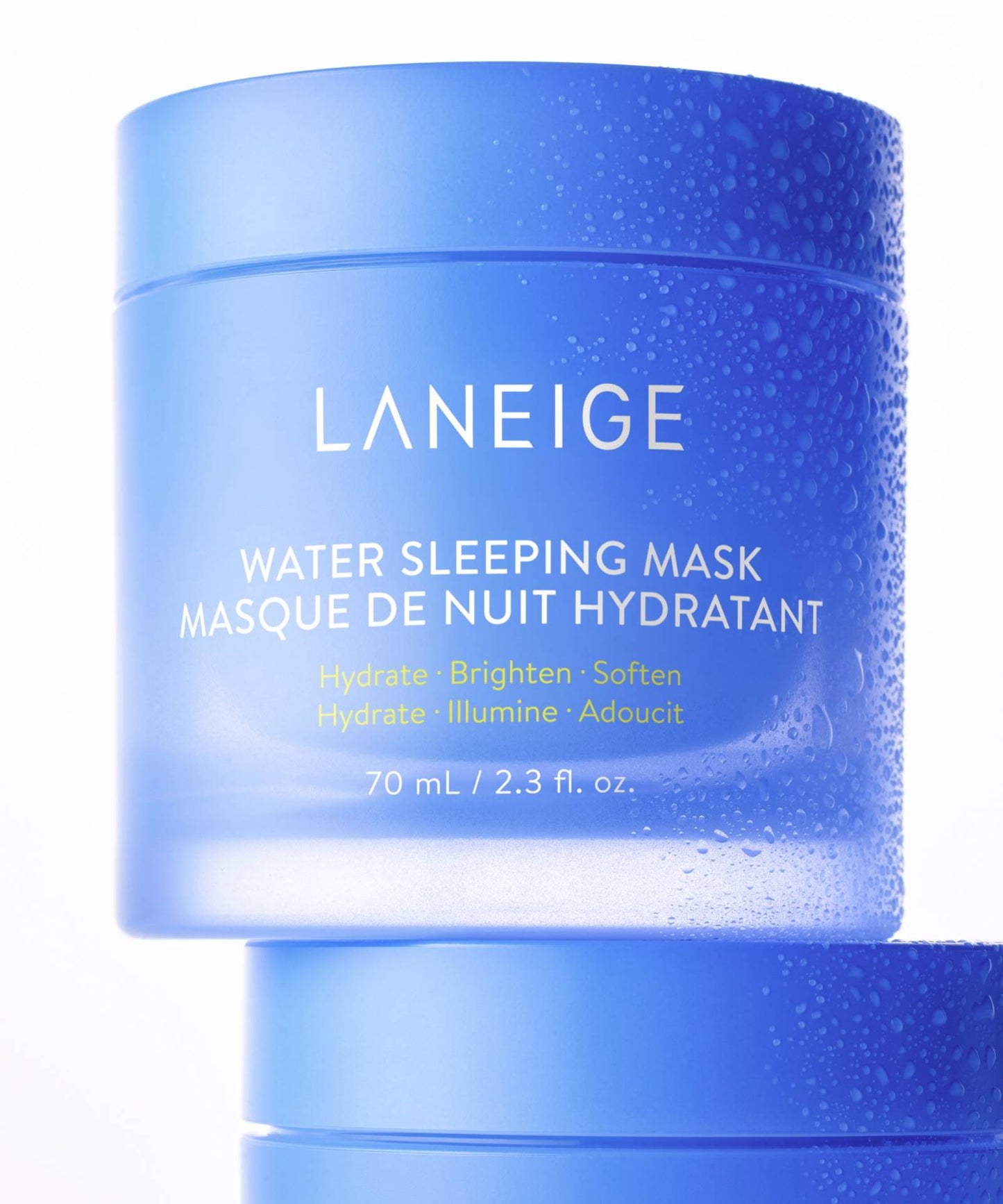Two blue containers of LANEIGEs 70ml Water Sleeping Mask are stacked, showcasing English and French text about its hydrating, brightening, and softening benefits with a Probiotics-derived complex. The dew-like texture enhances the overnight mask experience.