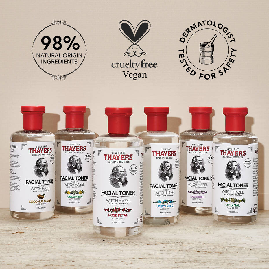 A display of THAYERS Alcohol-Free Witch Hazel Facial Toners with red caps features cucumber, rose petal, lavender, and unscented variants. The labels highlight natural ingredients along with vegan and cruelty-free properties for gentle skincare.