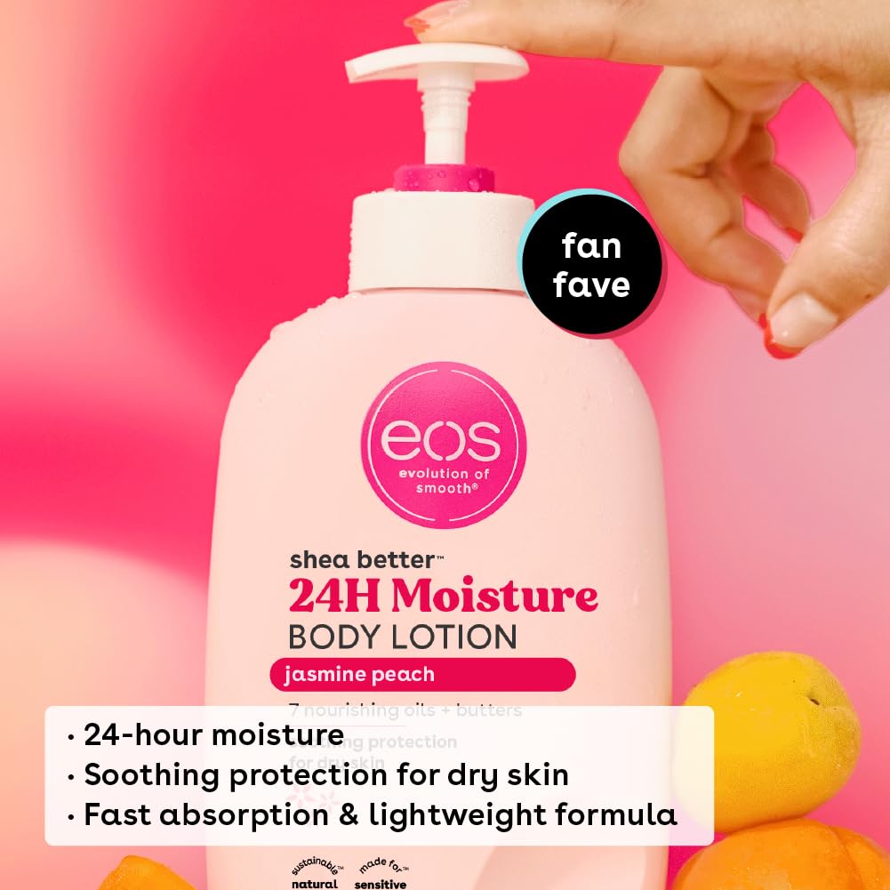 A hand pumps an eos Shea Better 24H Moisture Body Lotion - Jasmine Peach (473ml) bottle against a pink backdrop. Ideal for sensitive skin, its formula with Shea Butter ensures quick absorption and lasting hydration. Peaches beside the bottle highlight its natural ingredients.