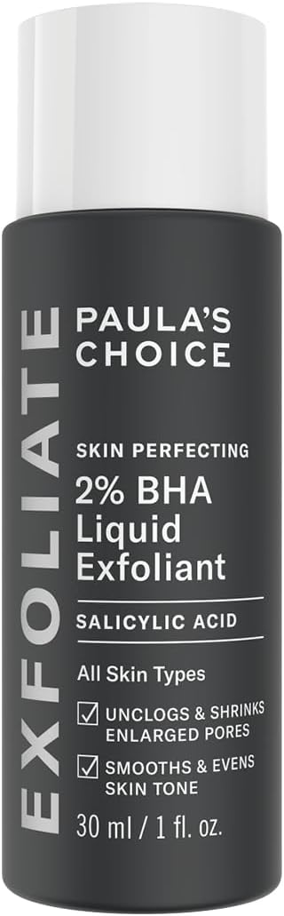 The black bottle of Paulas Choice SKIN PERFECTING BHA Liquid Exfoliant with white text uses salicylic acid to remove dead skin, unclog and shrink pores, and smooth skin tone. Suitable for all skin types, it has a 30 ml capacity and effectively removes blackheads.