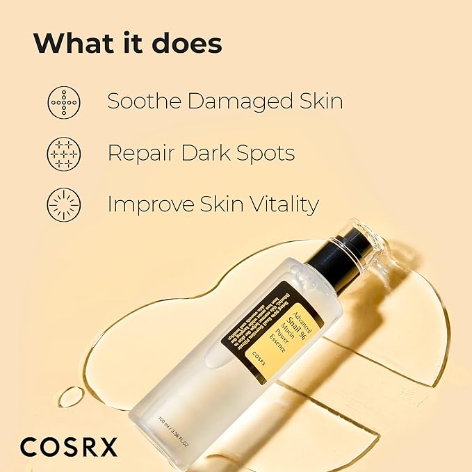 The COSRX Snail Mucin 96% Power Repairing Essence 3.38 OZ/100ML rests on a light yellow backdrop, promoting its benefits: Soothe Damaged Skin, Repair Dark Spots, and Improve Skin Vitality using snail secretion filtrate.