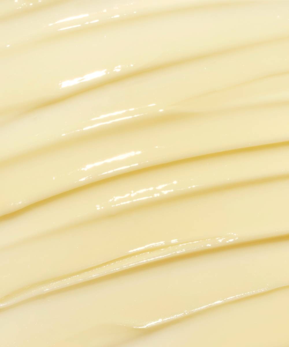 The Laneige Lip Sleeping Mask - Vanilla 20g by LANEIGE, with its smooth, creamy texture and glossy finish, is reminiscent of fresh butter with evenly spaced ridges and offers a promise of hydration.