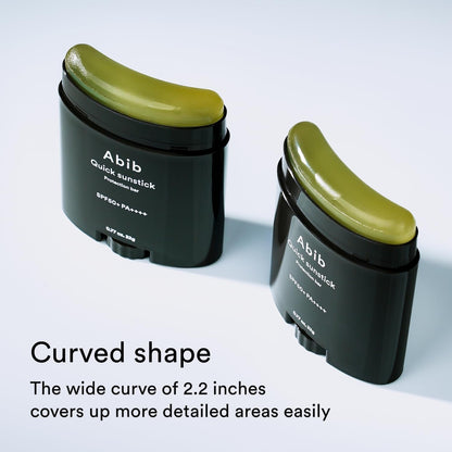 Two dark green Abib Quick Sunstick Protection Bars (22g) are displayed. They feature a wide, curved shape for detailed coverage and SPF50+ PA++++, enhancing skin barrier protection effortlessly with their 2.2-inch curve.