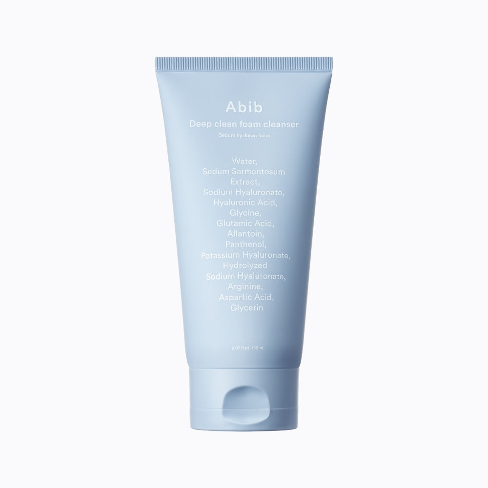 A sky-blue tube of Abib Deep Clean Foam Cleanser: Sedum Hyaluron Foam 150ml stands upright, featuring white text with ingredients like Water, Sedum Sarmentosum Extract, hyaluronic acid, and various acids. It includes a flip-top cap and is ideal for sensitive skin.