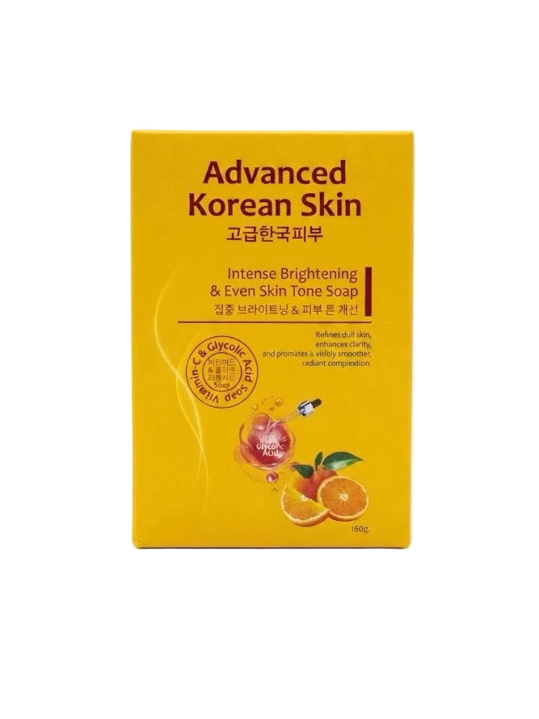 A yellow rectangular box of Advanced Korean Skin Intense Brightening & Even Skin Tone Soap, featuring red text and illustrations of citrus fruits and a peach on a white background.