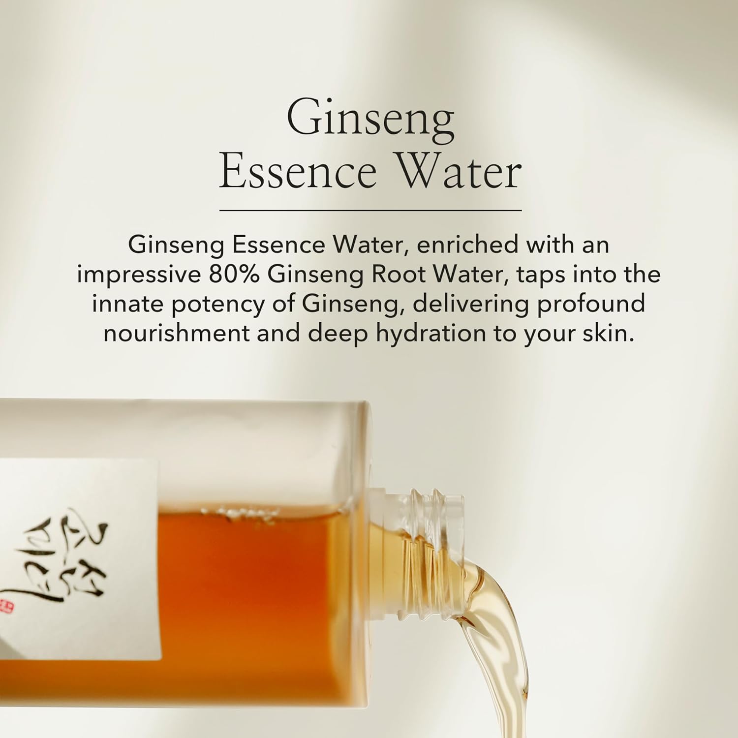 The Beauty of Joseon Ginseng Essence Water Toner, enriched with 80% Ginseng Root Water, pours from a transparent bottle against a light background. It embodies Korean beauty rituals by nourishing and hydrating skin for a glass skin effect.