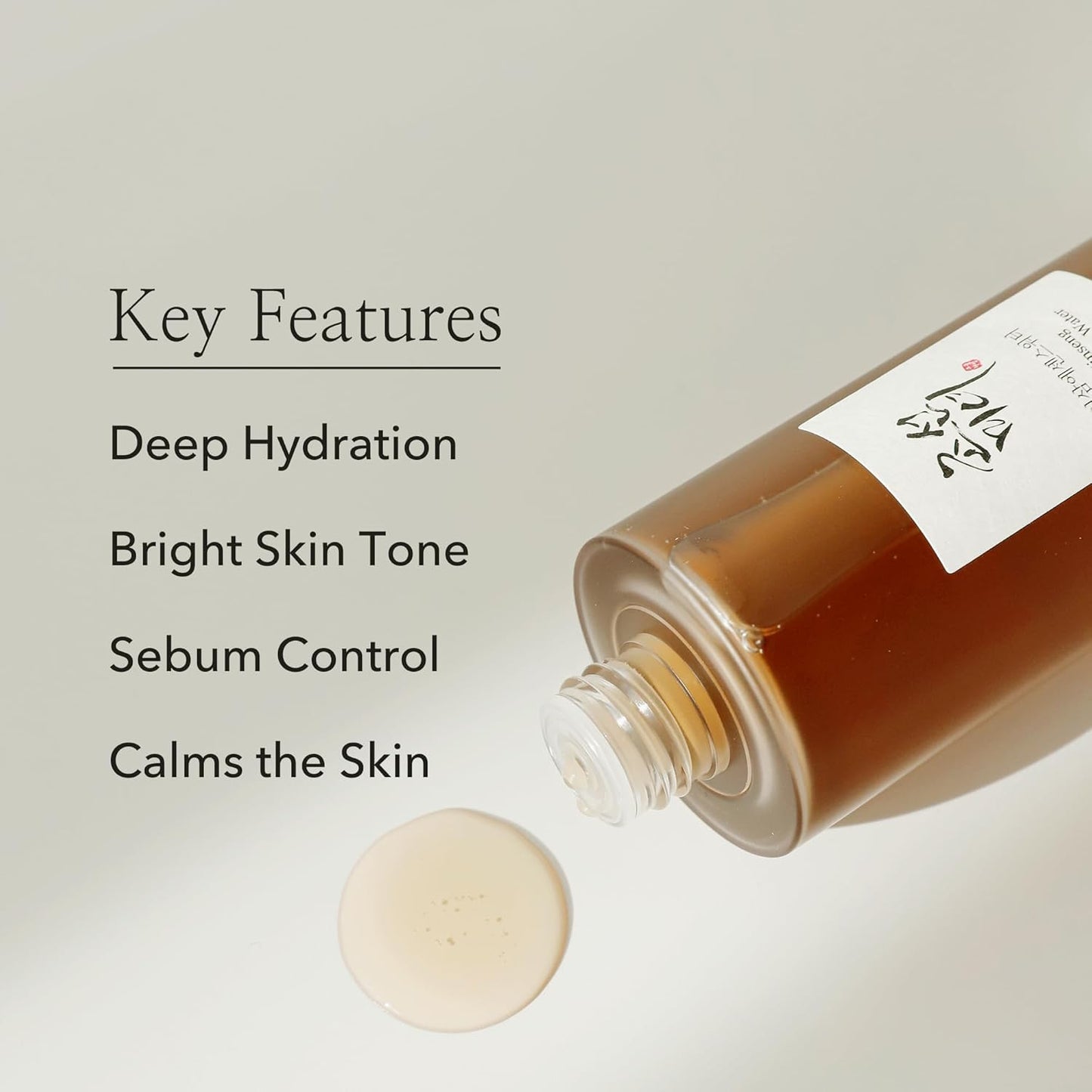 A Beauty of Joseon Ginseng Essence Water Toner bottle spills a small puddle on a beige surface, with text highlighting its features: deep hydration, brightens skin tone, controls sebum, and calms the skin. Achieve glass skin with this formula inspired by Korean beauty rituals.