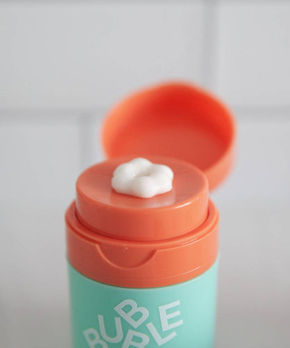 The teal and orange container with a flip-top lid reveals a dab of white Bubble Slam Dunk Hydrating Moisturiser Cream. The word RUB hints at its blend of Aloe Leaf Juice and Vitamin E.
