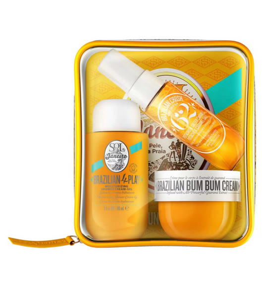 The Sol de Janeiro Brazilian Bum Bum Jet Set includes a yellow, transparent travel pouch with minis of Brazilian 4 Play Moisturizing Shower Cream-Gel, Brazilian Bum Bum Cream, and Brazilian Crush Body Fragrance Mist, all in the delightful Cheirosa 62 scent.