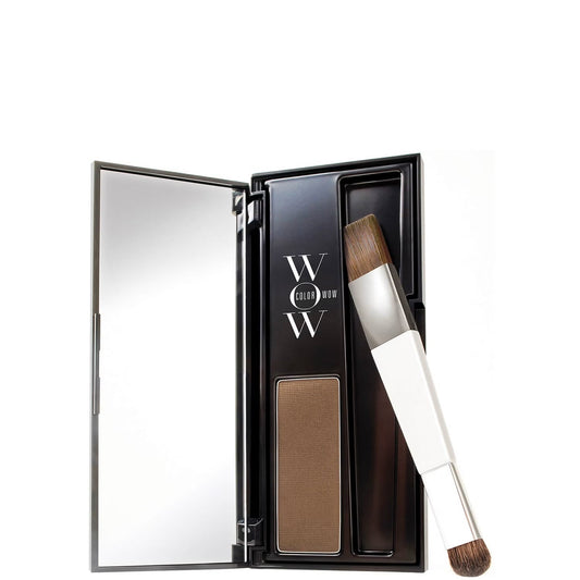 Makeup product with mirror and brush in open case on white background