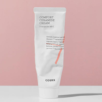 Cosrx Comfort Ceramide Cream tube on a pink background