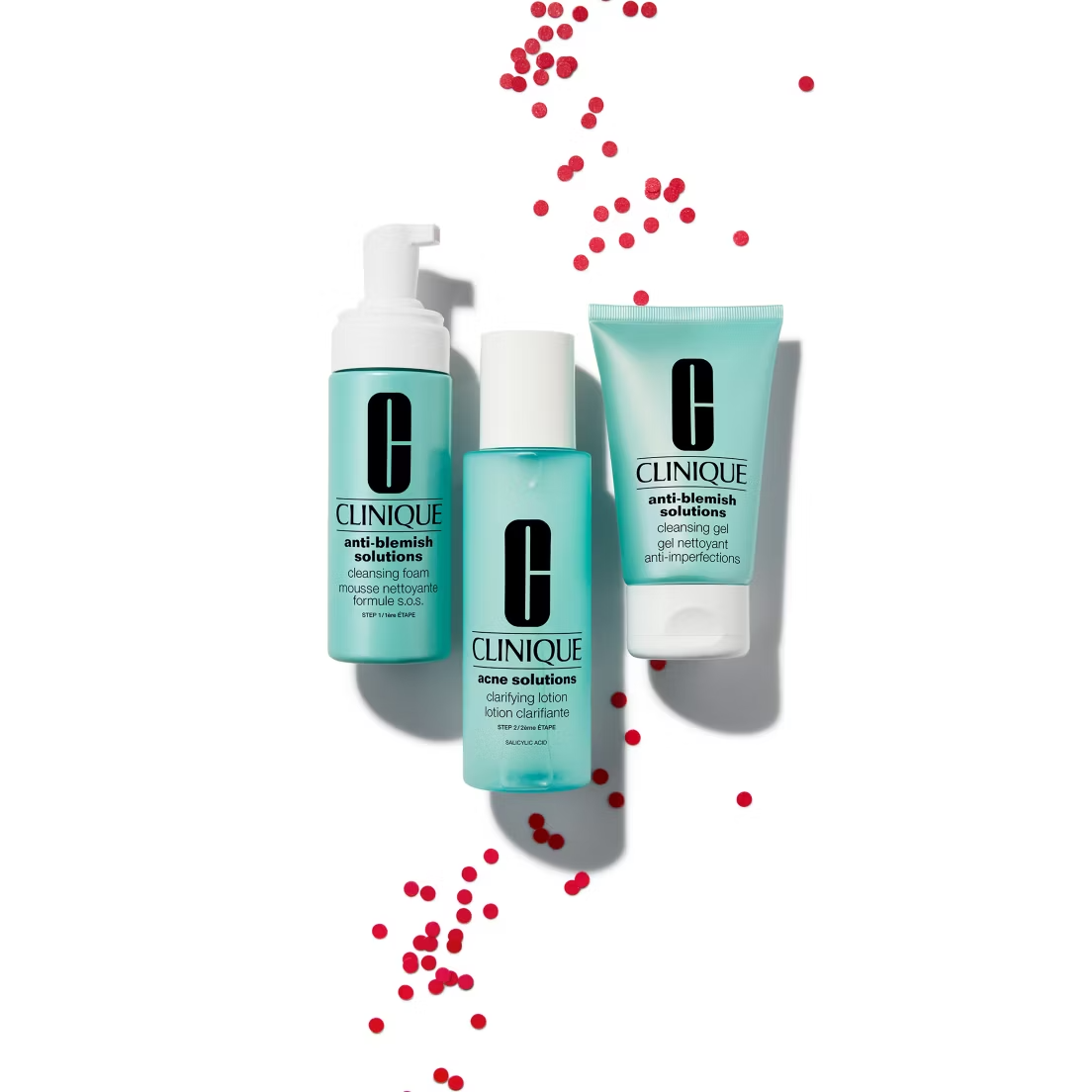 Clinique Anti-Blemish Solutions Cleansing Foam 125ml, in a teal-blue bottle, is shown on a white background with red dots. This acne-fighting cleanser helps promote clearer skin.