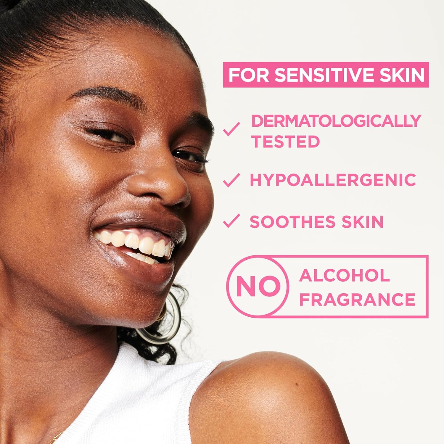 A smiling person with smooth skin embodies Garnier Micellar Cleansing Water. This dermatologically tested, hypoallergenic makeup remover for sensitive skin soothes effectively without alcohol or fragrance.