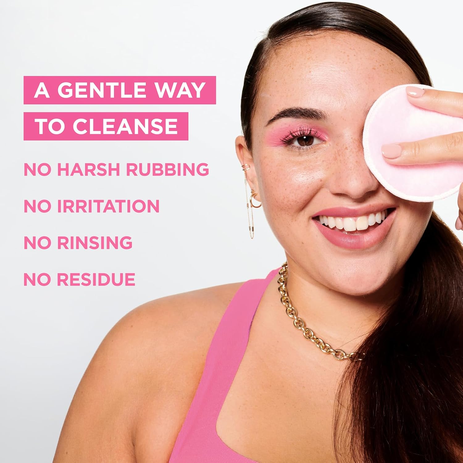 A smiling woman with sensitive skin uses a pink facial pad on her eye, matching her pink top. The text beside her says, A gentle way to cleanse: No harsh rubbing, no irritation, no rinsing, no residue, highlighting Garnier Micellar Cleansing Waters makeup removal benefits.