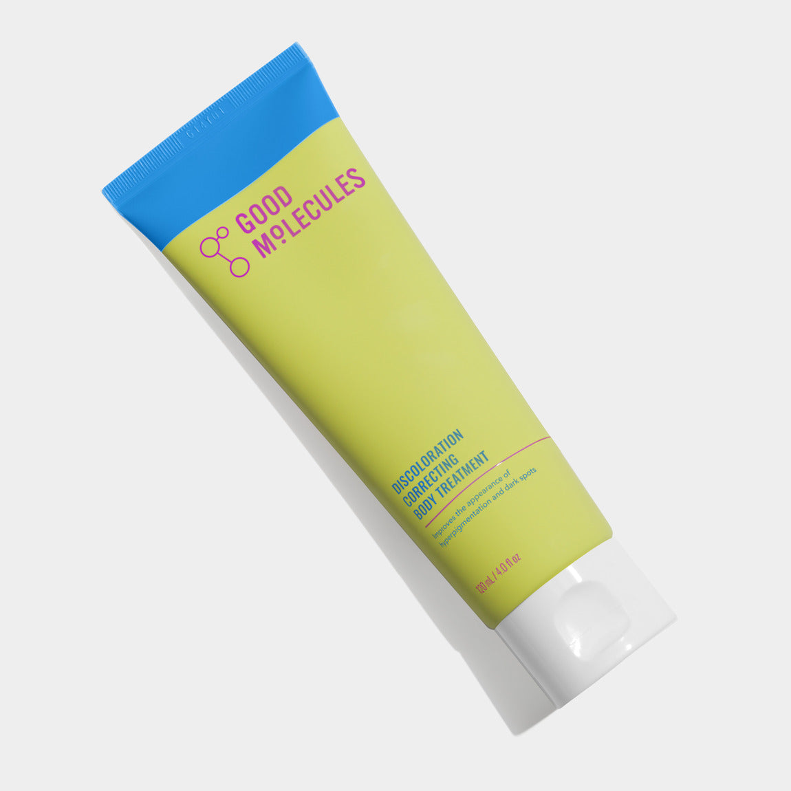 A yellow and light green tube of Good Molecules Discoloration Correcting Body Treatment 120ML/4 FL OZ with a blue cap and colorful text rests on a white surface.