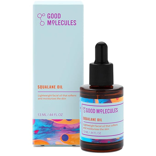 A 13ml amber glass bottle of Good Molecules Squalane Oil with a black dropper cap, placed next to its colorful, abstract-patterned packaging box.