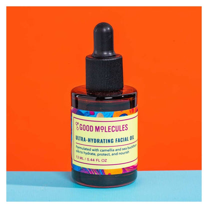 Bottle of Good Molecules ultra-hydrating facial oil on an orange and blue background