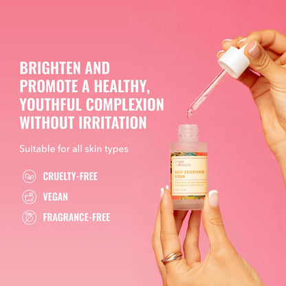 A hand holds an open Good Molecules Daily Brightening Serum 30ml as another uses a dropper. Text: “Brighten and promote youthful skin with beta arbutin—gentle, no irritation.” Icons: cruelty-free, vegan, fragrance-free. Pink background.