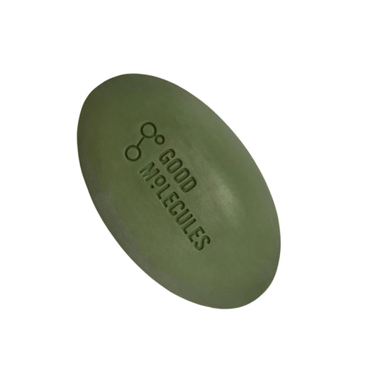 The Good Molecules Brightening & Dark Spots Bar with Kojic Acid, an 85g green oval soap embossed with the brand name and a chemical structure. It’s designed to brighten skin and reduce dark spots, standing out against a plain white background.