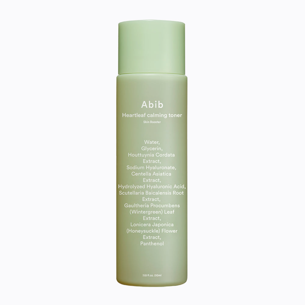 The Abib Heartleaf Calming Toner Skin Booster comes in a light green cylindrical bottle with a green cap, featuring ingredients such as water, glycerin, and sodium hyaluronate. Infused with heartleaf and plant extracts, it rejuvenates skin for a calming effect.