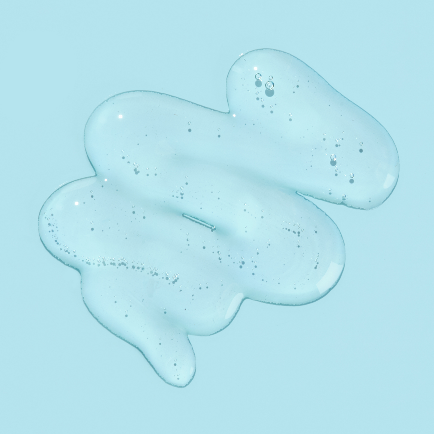 Blue gel or slime with bubbles on a light blue background