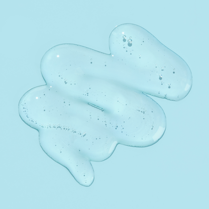 Blue gel or slime with bubbles on a light blue background