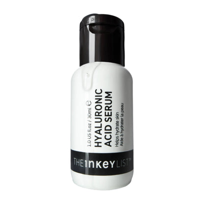 The Inkey List™ Hyaluronic Acid Serum features a white bottle with a black cap, brand name on a black stripe, and offers moisture-binding properties ideal for reducing fine lines. Contains 1.0 US fl oz / 30ml.