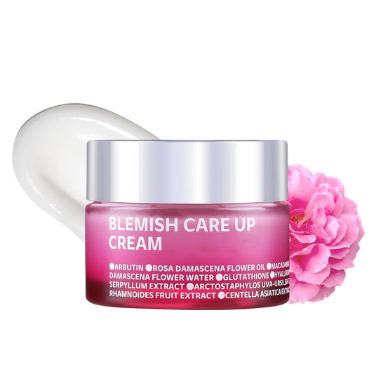 A pink jar of ISOI Blemish Care Up Cream 55ml, enriched with Bulgarian Rose Oil, sits by a cream swirl and pink flower. The elegant translucent packaging represents its function as an overnight mask for moisturization and blemish treatment.
