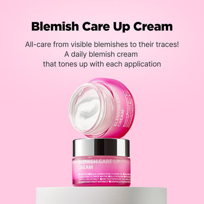 An open pink jar of ISOI Blemish Care Up Cream 55ml reveals white cream, with the lid beside it. Text above states: ISOI Blemish Care Up Cream - Targets visible blemishes and traces! Enhanced with Bulgarian Rose Oil for superior blemish care and moisturizing overnight mask effect.