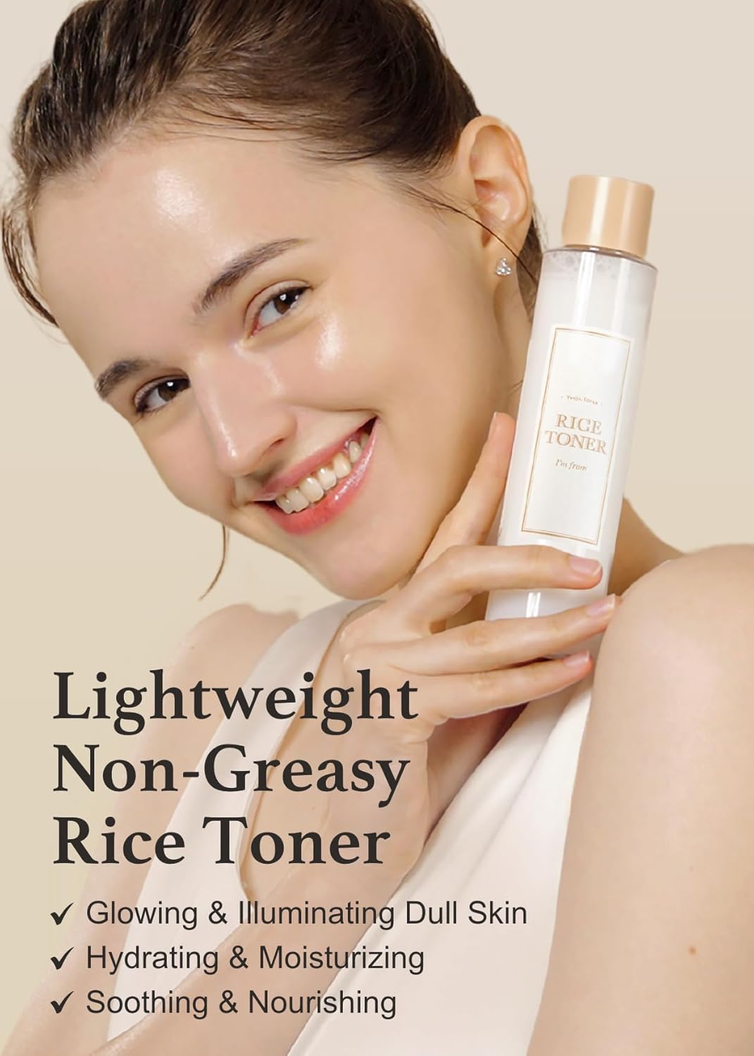 A smiling person holds a bottle of IM FROM Rice Toner with Rice Extract. Text on the image reads: Lightweight Non-Greasy Formula. Glowing & Illuminating Dull Skin. Hydrating & Moisturizing. Soothing & Nourishing.