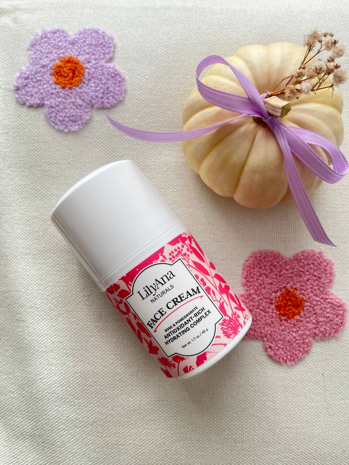 LilyAna Rice Cream container with decorative flowers and a small pumpkin on a light background