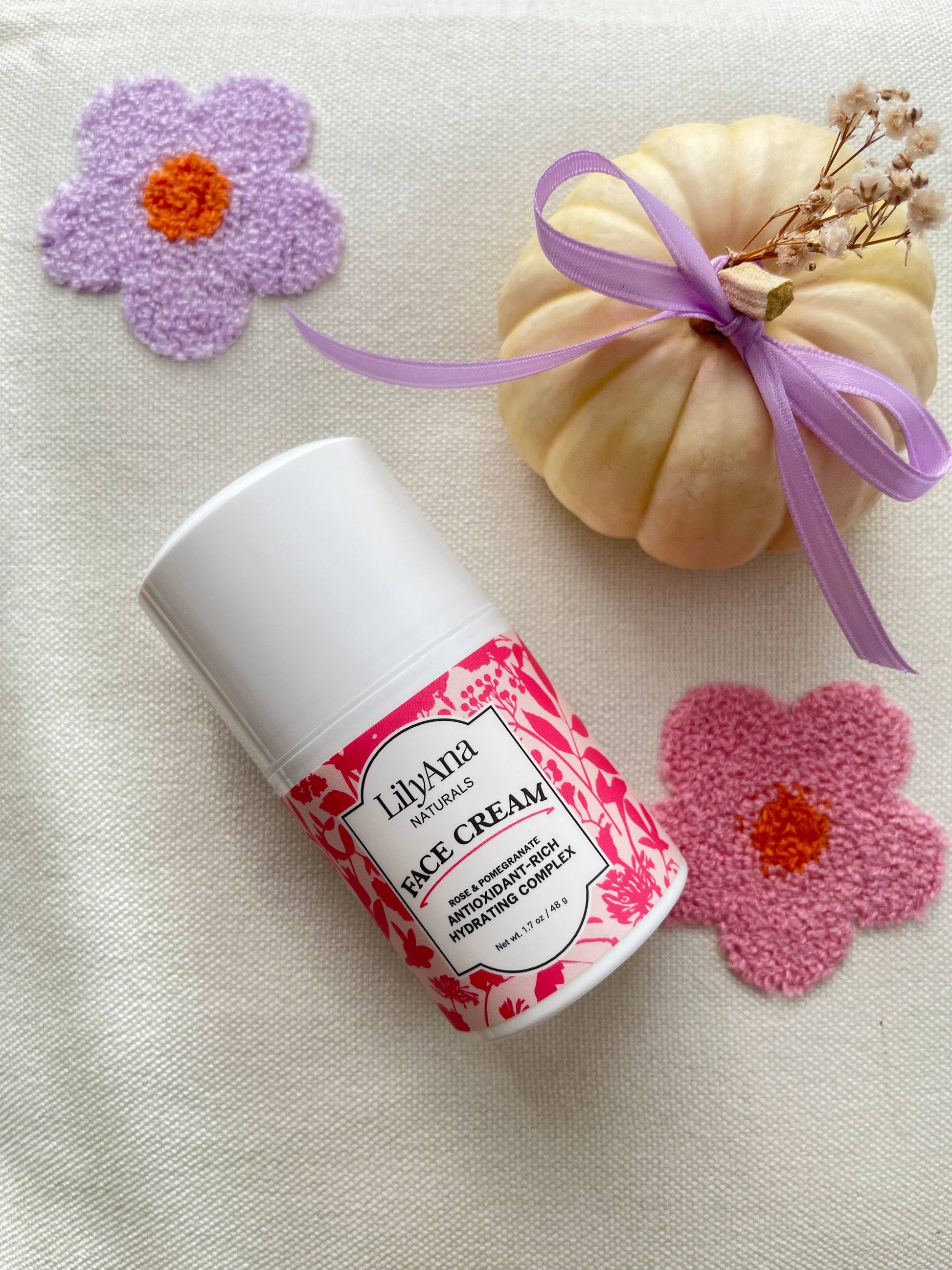 LilyAna Rice Cream container with decorative flowers and a small pumpkin on a light background