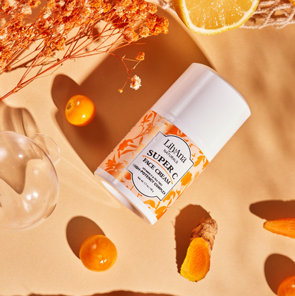 Super C face cream bottle with orange flowers and fruits on a beige background