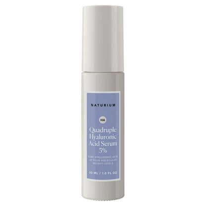 A 30ml bottle of NATURIUM Quadruple Hyaluronic Acid Serum 5%, featuring a blue and white label and light gray cap, hydrates skin for a visibly plump appearance.