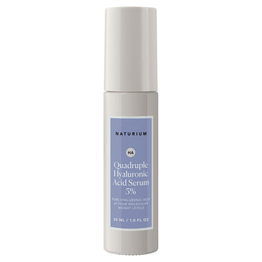A 30ml bottle of NATURIUM Quadruple Hyaluronic Acid Serum 5%, featuring a blue and white label and light gray cap, hydrates skin for a visibly plump appearance.