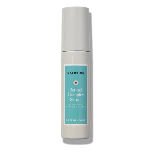 A 30ml bottle of NATURIUM Retinol Complex Serum featuring a light blue label, white cap, and white bottle—an anti-aging serum by NATURIUM designed to refine skin texture.
