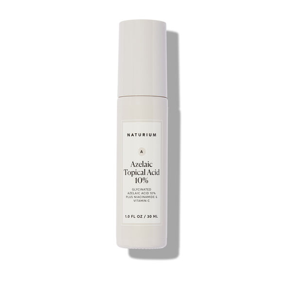A 30ml white bottle of NATURIUM Azelaic Acid 10% Brightening & Texture Refining Serum, with a minimalistic gray-label design, stands upright on a white background—ideal for improving uneven skin tone.