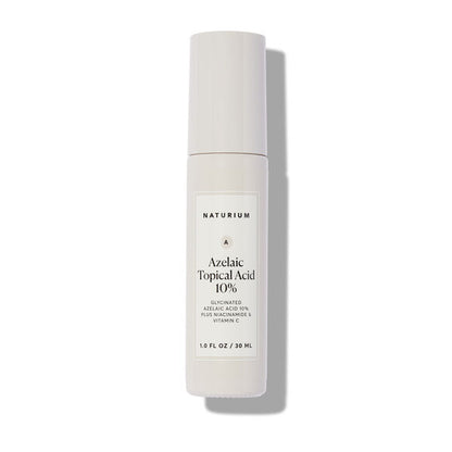 A 30ml white bottle of NATURIUM Azelaic Acid 10% Brightening & Texture Refining Serum, with a minimalistic gray-label design, stands upright on a white background—ideal for improving uneven skin tone.