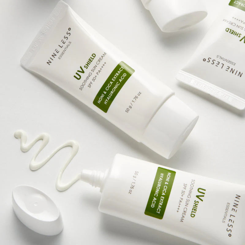 Two bottles of Nine Less UV Shield sunscreen on a white background