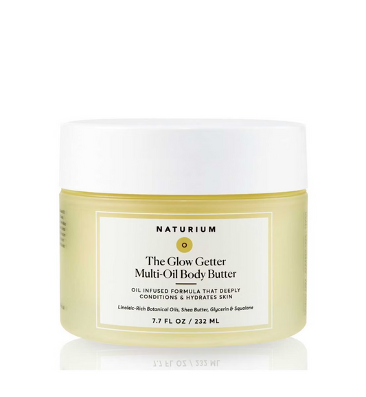 A 7.7 fl oz (232 ml) jar of NATURIUM The Glow Getter Multi-Oil Body Butter with a white lid and pale yellow container, featuring an oil-infused formula that deeply hydrates and conditions skin.
