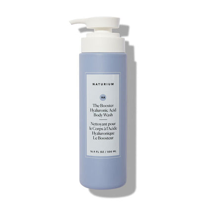 A 500ml light blue bottle of Naturium The Booster Hyaluronic Acid Body Wash features a white pump and label with black text. This hydrating body wash is from Naturium and contains 16.9 fl oz (500 ml) of product.