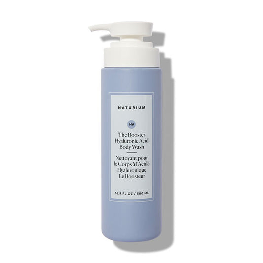A 500ml light blue bottle of Naturium The Booster Hyaluronic Acid Body Wash features a white pump and label with black text. This hydrating body wash is from Naturium and contains 16.9 fl oz (500 ml) of product.