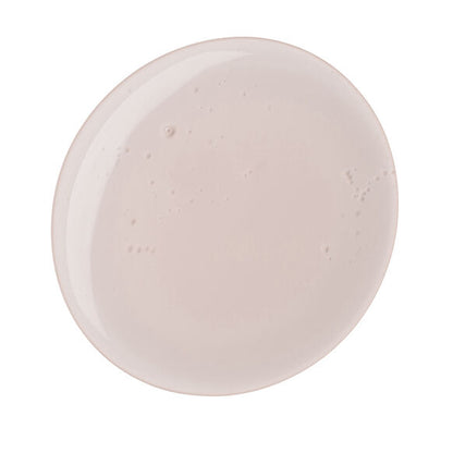 A round, pale pink ceramic plate with a glossy, dimpled finish evokes the soft tones of Naturium The Booster Hyaluronic Acid Body Wash 500ml packaging by Naturium, displayed on a white background.