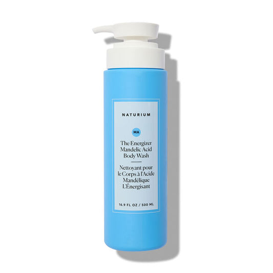 Blue bottle of Naturium body wash with pump on a white background
