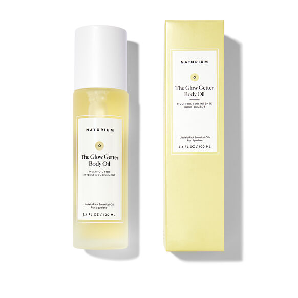 Naturium The Glow Getter Body Oil bottle and packaging on a white background